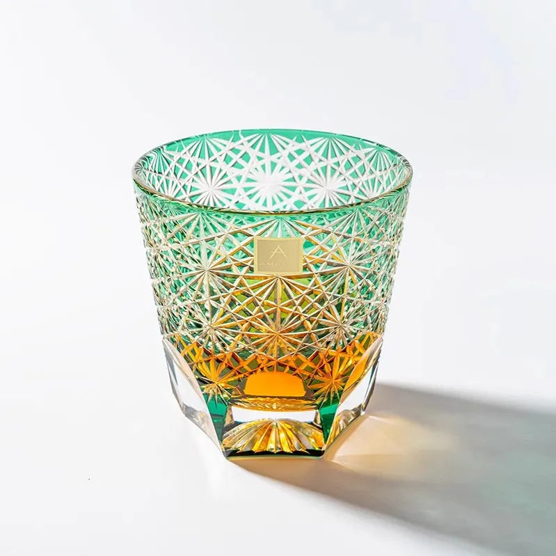 Edo Kiriko Emerald Starburst whisky glass front view with amber whisky and green cuts
