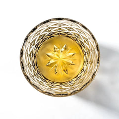 Edo Kiriko Starlight Crystal whisky glass top view showing golden starburst base