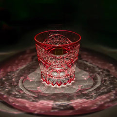 Edo Kiriko Rose Starburst whisky glass on dark surface with red light reflection