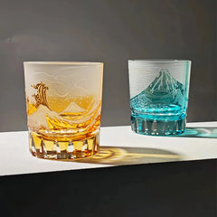 Edo Kiriko Fuji Wave whisky glasses in amber and blue colors shown side by side