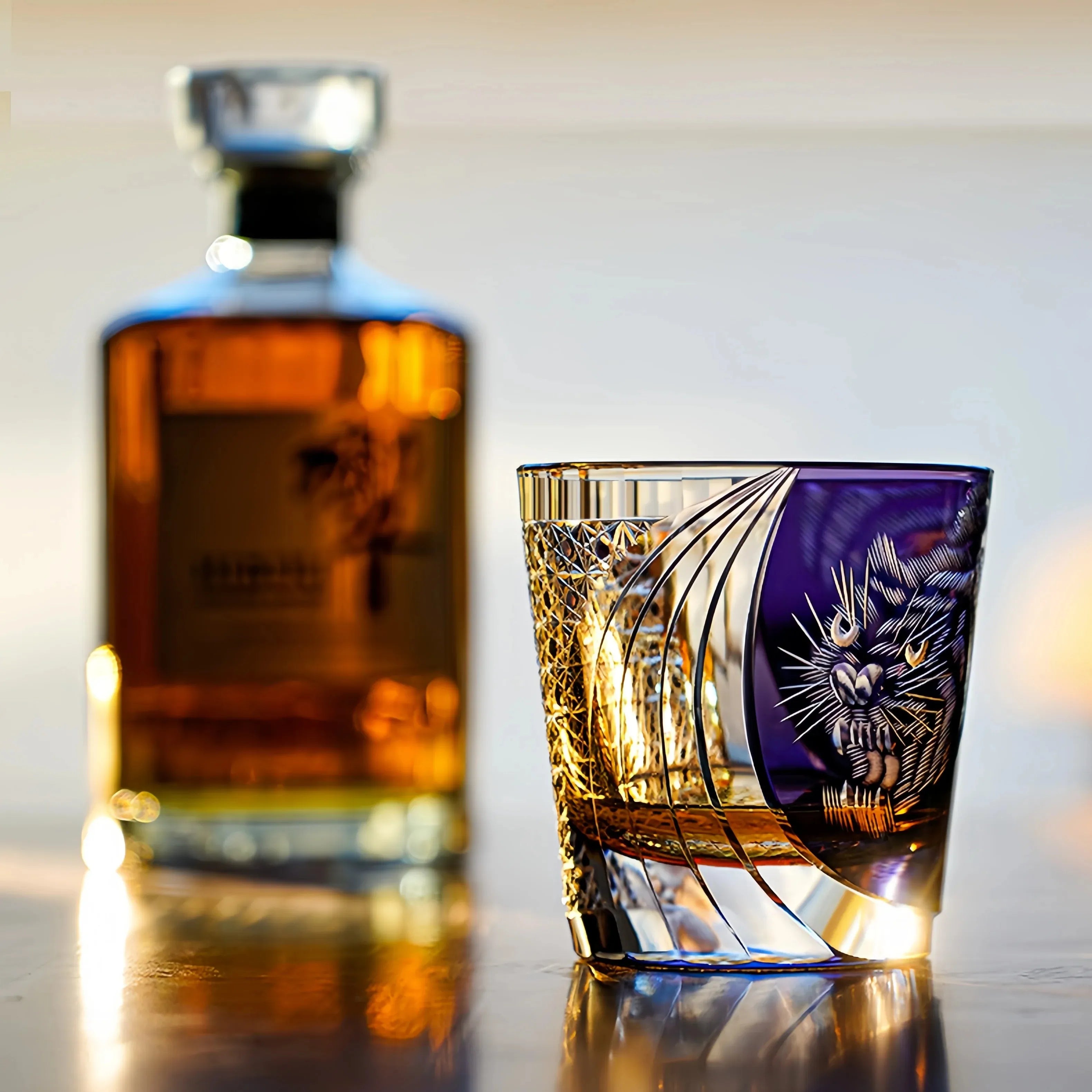 Edo Kiriko Murasaki Tora whisky glass beside whisky bottle on bar setting