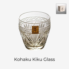 Kohaku Kiku glass on white with amber tint, chrysanthemum cuts, and gold label