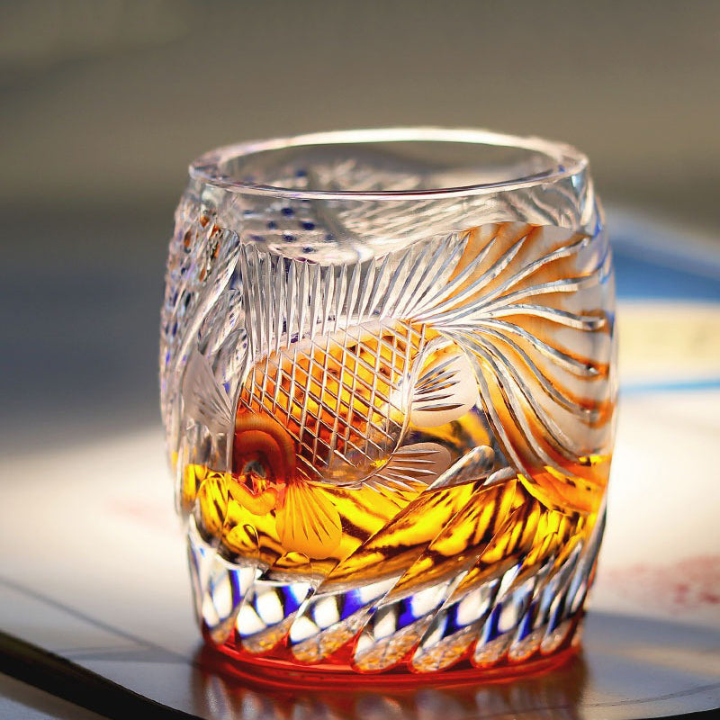 Edo Kiriko whisky glass with amber drink showing Japanese cut glass craftsmanship