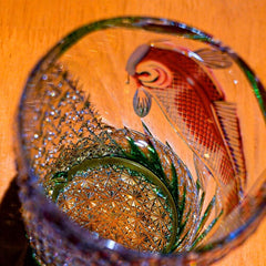 Top view of Edo Kiriko Kingyo Nishiki whisky glass showing fish motif and cut crystal base