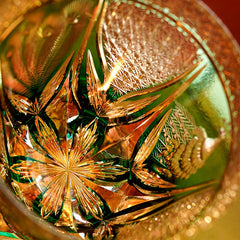 Edo Kiriko Emerald Peacock close-up showing green and gold hand-cut crystal pattern
