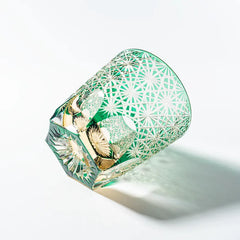 Edo Kiriko Emerald Starburst whisky glass lying on side with pale green cut pattern