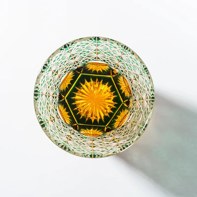 Edo Kiriko Emerald Starburst whisky glass base view showing green and gold starburst cut