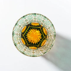 Edo Kiriko Emerald Starburst whisky glass base view showing green and gold starburst cut