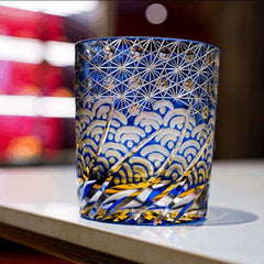 Edo Kiriko Blue Amber whisky glass standing on tabletop with geometric cut detail