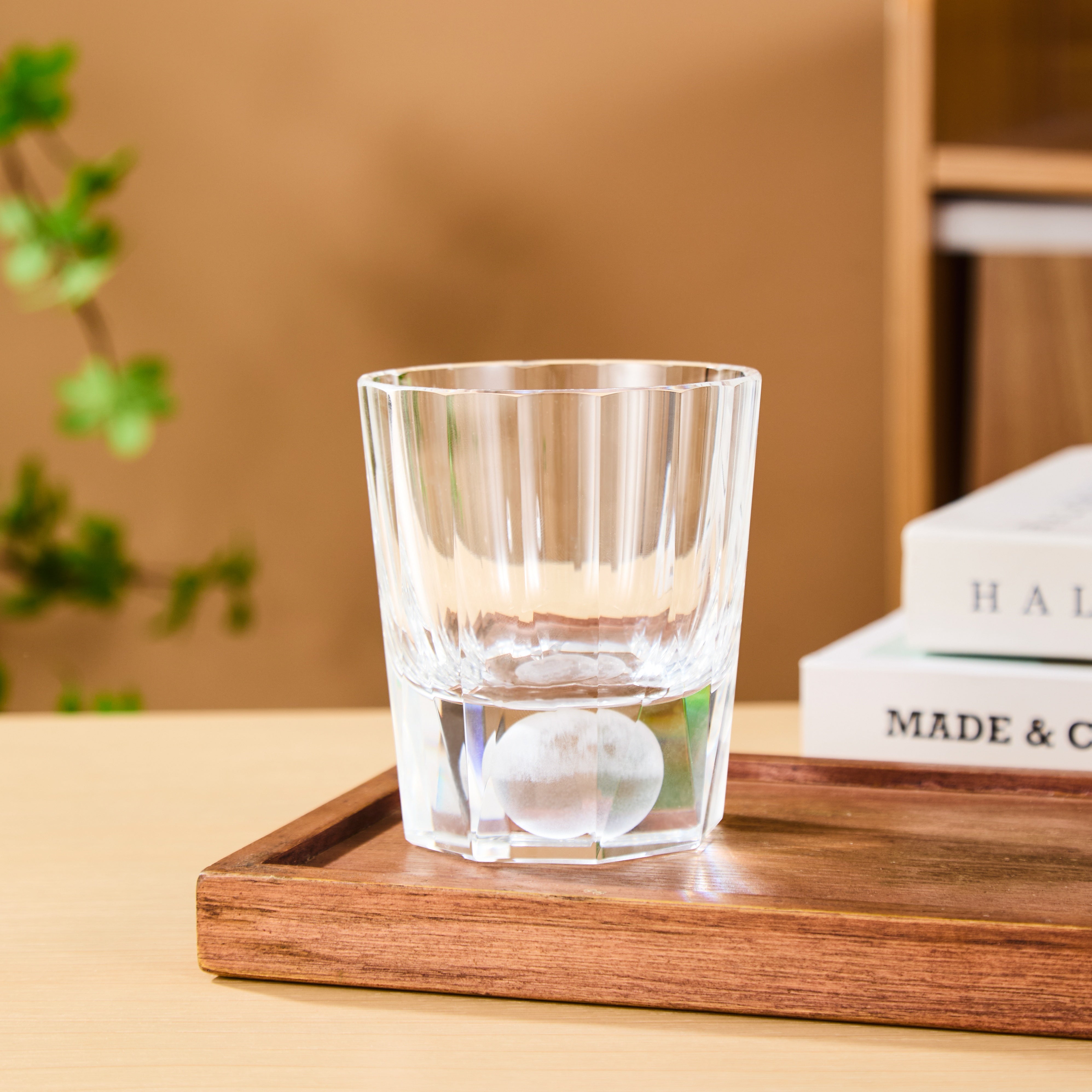 Edo Kiriko Tsukikage whisky glass on wooden tray with clear crystal and vertical cuts