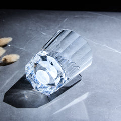 Edo Kiriko Tsukikage whisky glass lying on stone with circular moon base detail