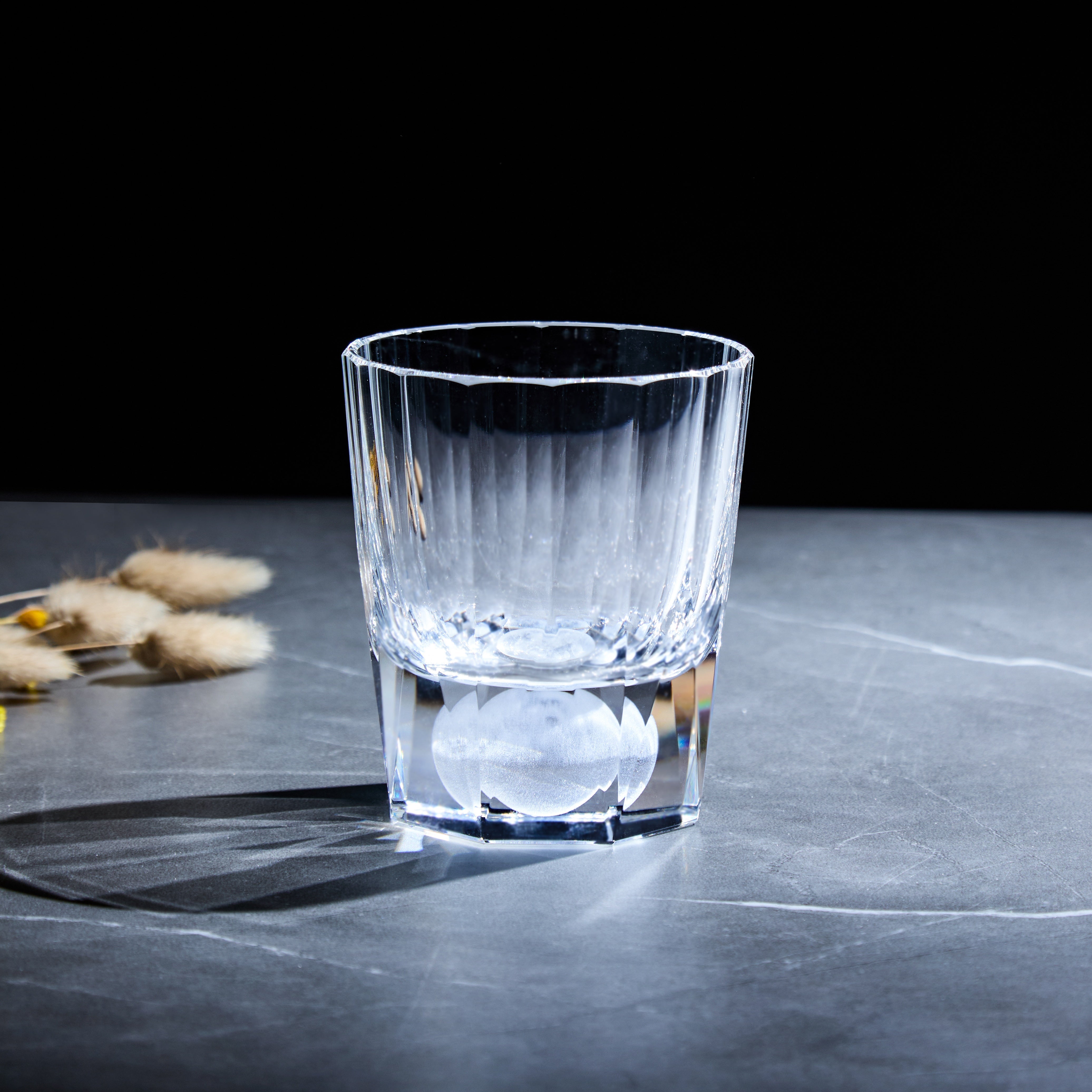 Edo Kiriko Tsukikage clear whisky glass standing on stone with soft natural light