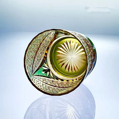Edo Kiriko Sparkling Galaxy whisky glass base view with green and gold starburst cut