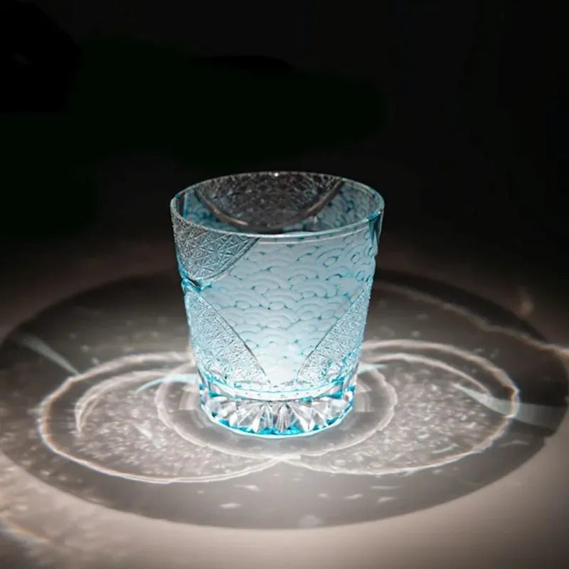 Edo Kiriko Ink Blue Cloud whisky glass on dark surface with circular light reflection