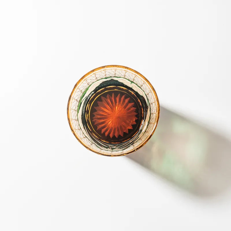 Edo Kiriko Mount Fuji Green whisky glass base view with amber radial cut pattern