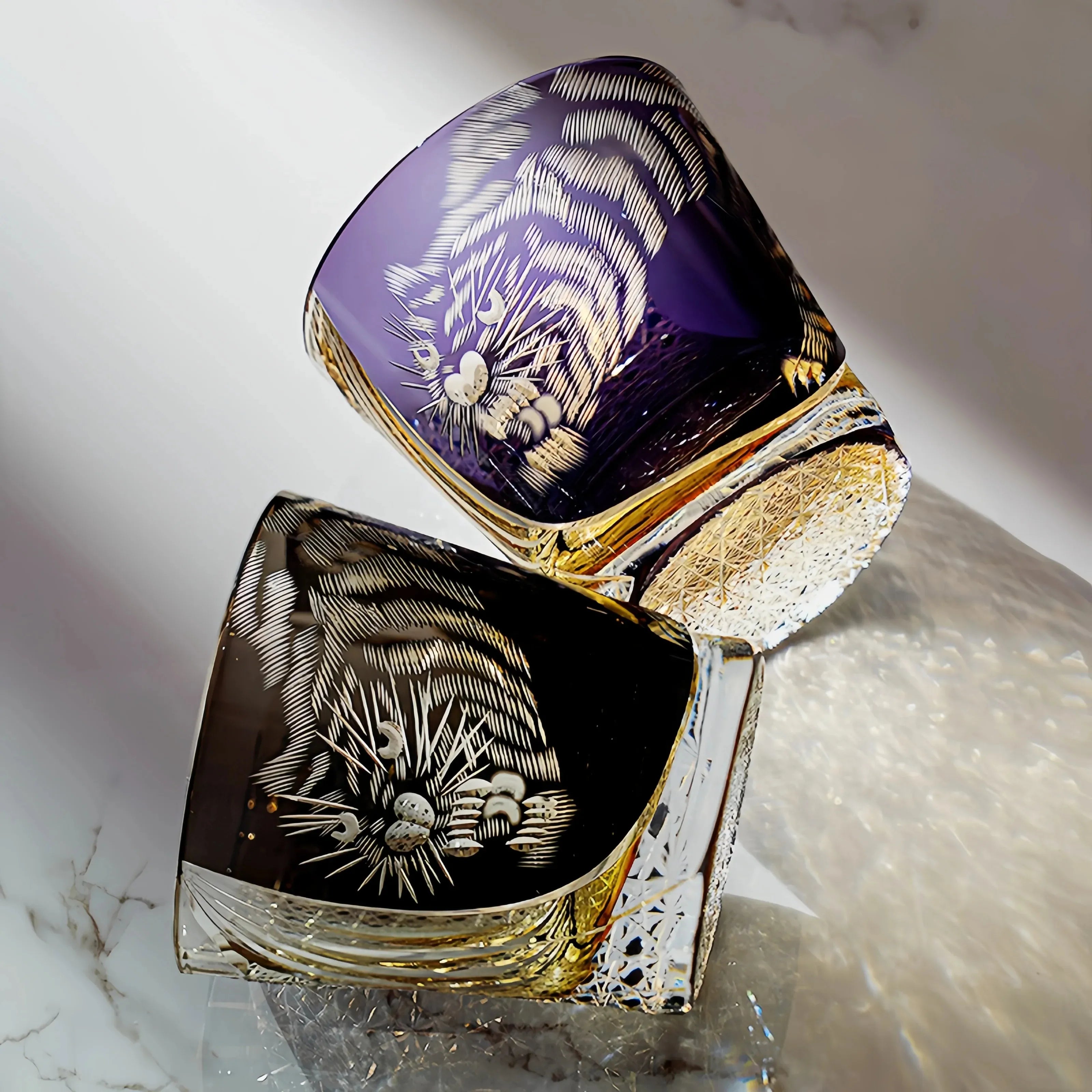 Edo Kiriko Kuro Tora and Murasaki Tora whisky glasses paired on light background