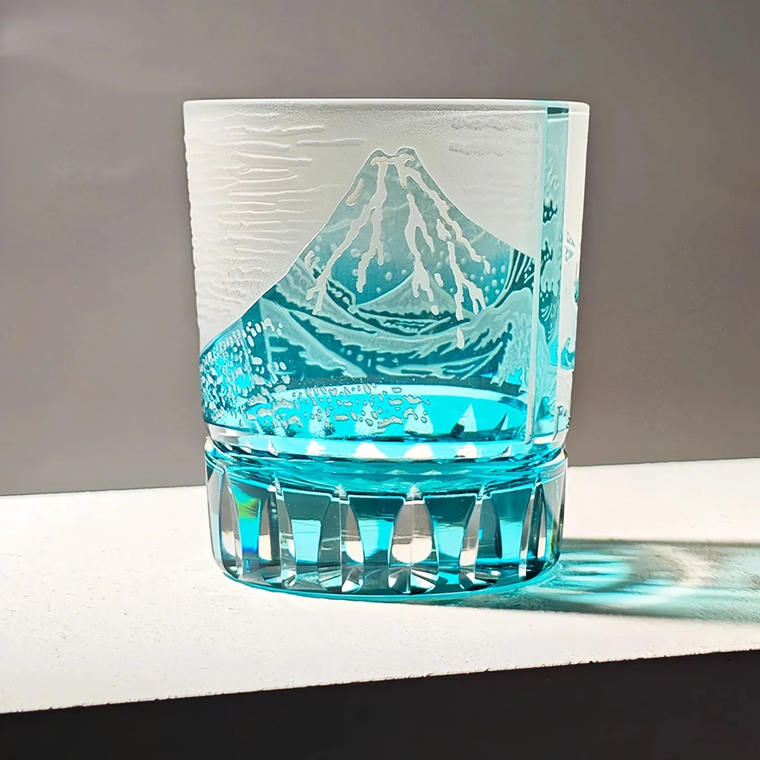 Edo Kiriko Fuji Wave blue whisky glass with Mount Fuji design and turquoise base